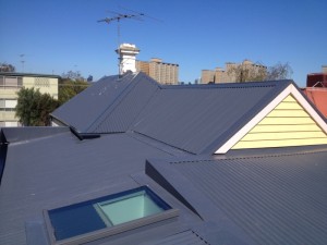 Colorbond metal reroof with Velux Skylight in Flemington - Rear Finished (image)