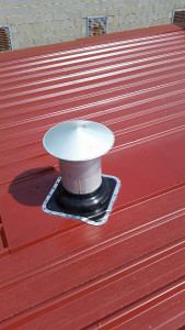 Flue installed with decktite into Colorbond Kliplok Roof - Blackburn South (image)