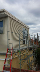 Colorbond corrugated wall cladding installed complete with new fascia and capping - Doncaster East