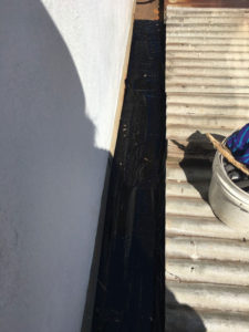 Lquid rubber sealant applied to box gutter (image)