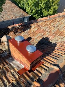 Chimney capping installed with cowls - Toorak