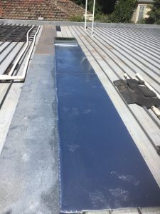 Metal roof repair with Galvanised flashings installed - East Ivanhoe