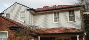 Weatherboard metal cladding installed with Colorbond guttering and downpipes| After | Glen_Iris | Roofrite